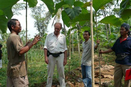Mr. Melle discussing forest management with farmer