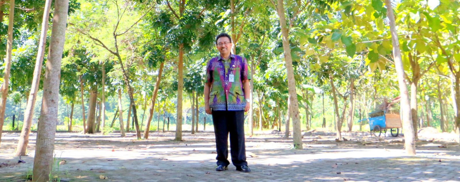 Pak Ade with the Trees he planted in 2008