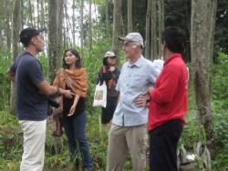 Members of ACIAR research group visit the community forest of Mr. Sunardi (red shirt), a member of the local Farmer Group